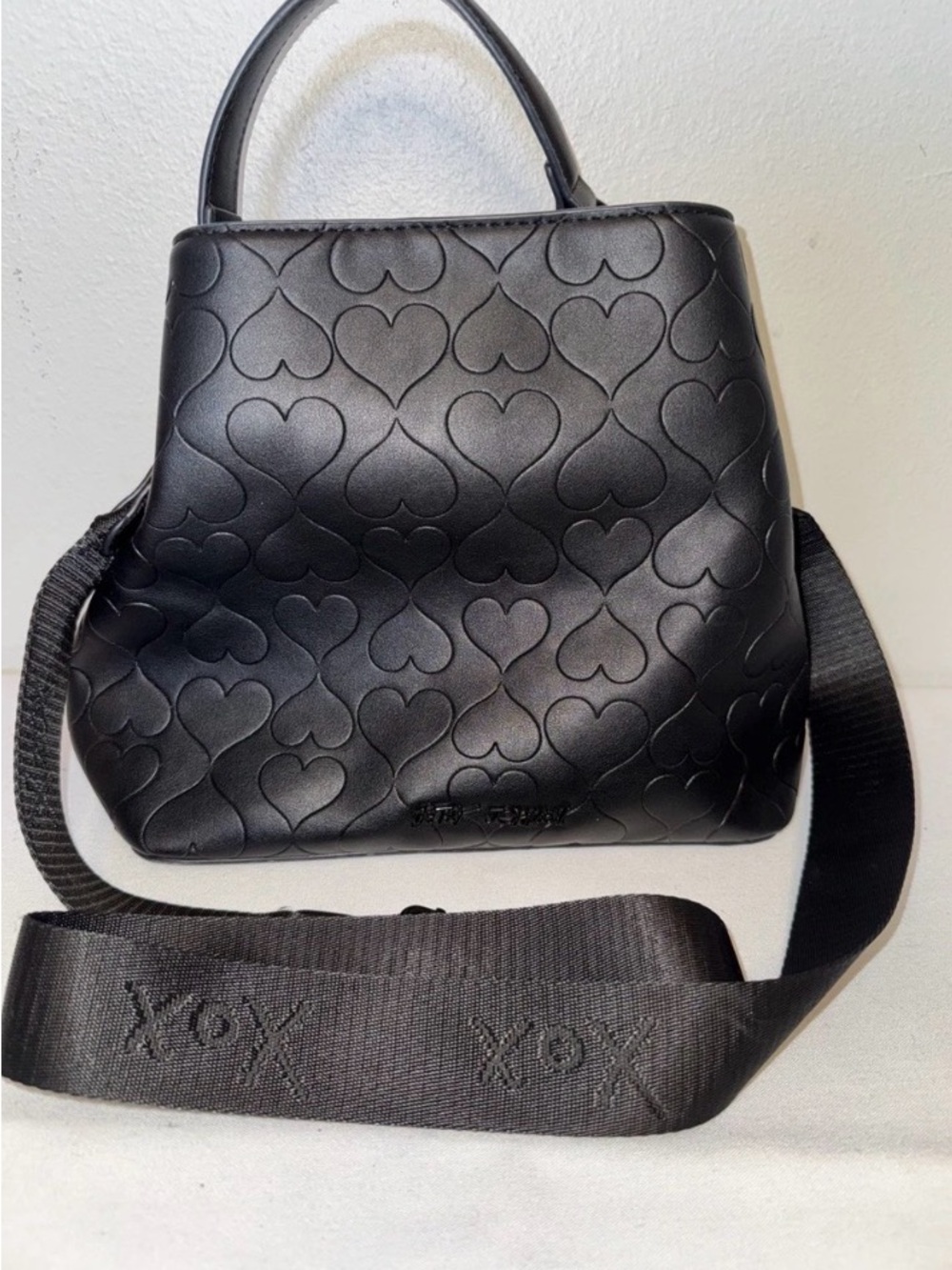 Betsey Johnson black bucket bag embossed heart design XOX strap